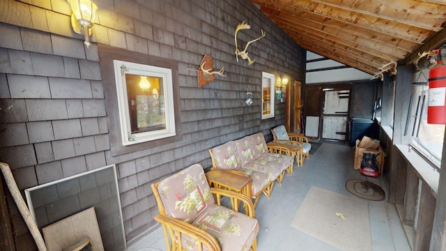 interior space with wood ceiling and vaulted ceiling