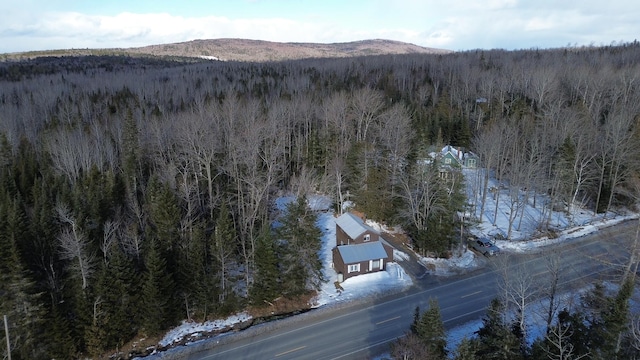 snowy aerial view with a mountain view