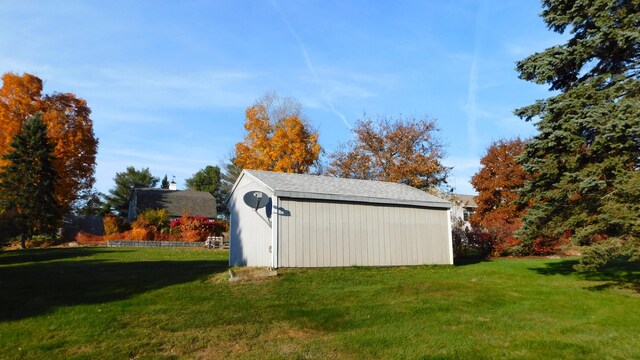 view of outbuilding with a lawn