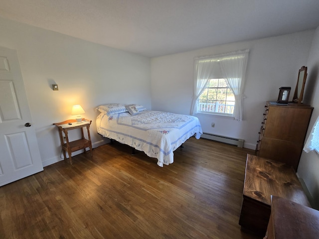 bedroom featuring a baseboard radiator and dark hardwood / wood-style flooring