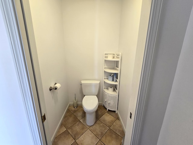 bathroom featuring tile patterned flooring and toilet