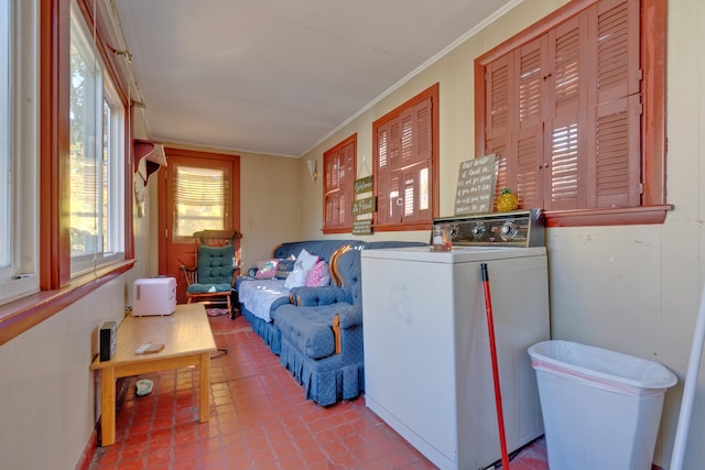 interior space featuring washer / dryer and crown molding