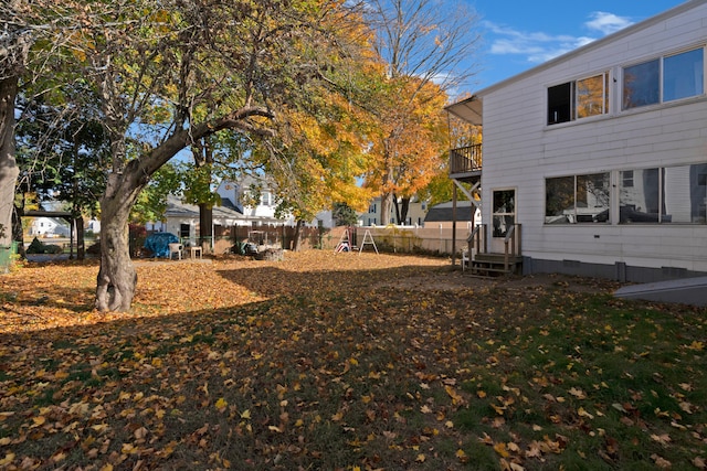 view of yard featuring a balcony