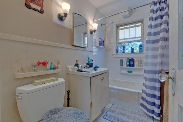 full bathroom with vanity, toilet, shower / bath combination with curtain, and tile walls