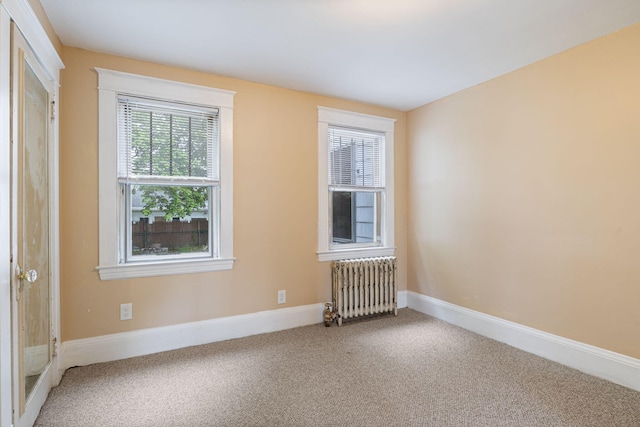 19 Harding St, Biddeford, ME 04005 - carpeted empty room featuring radiator and baseboards