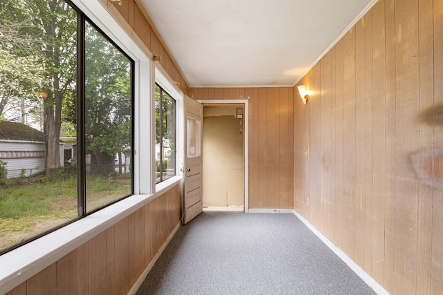 19 Harding St, Biddeford, ME 04005 - unfurnished sunroom featuring wooden walls, carpet, and baseboards
