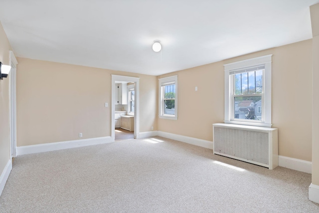 19 Harding St, Biddeford, ME 04005 - carpeted empty room with healthy amount of natural light and baseboards