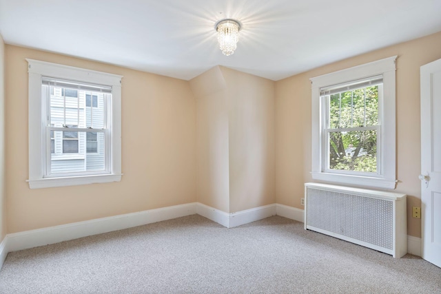 19 Harding St, Biddeford, ME 04005 - unfurnished room with radiator heating unit, carpet, and baseboards