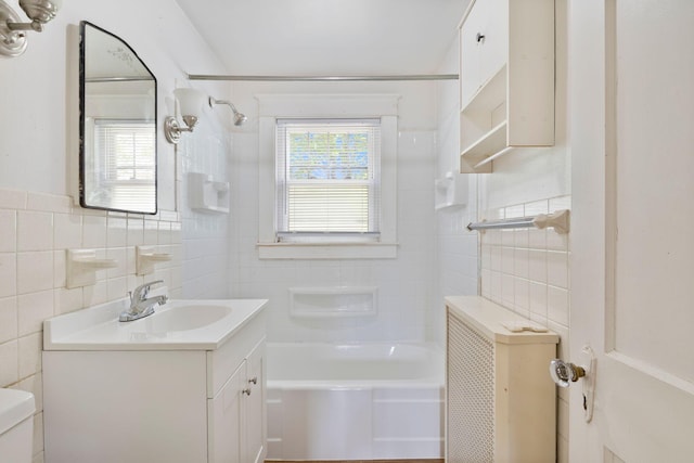 19 Harding St, Biddeford, ME 04005 - full bath with tile walls, toilet, shower / bath combination, and vanity