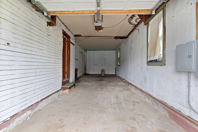 19 Harding St, Biddeford, ME 04005 - garage with electric panel and a garage door opener