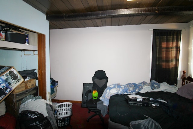 bedroom featuring wood ceiling and beamed ceiling