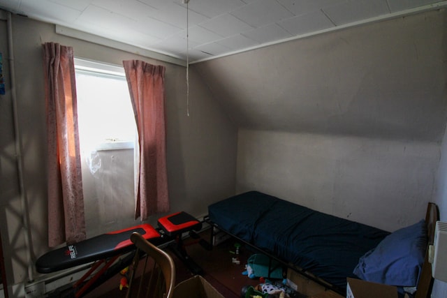 bedroom with lofted ceiling