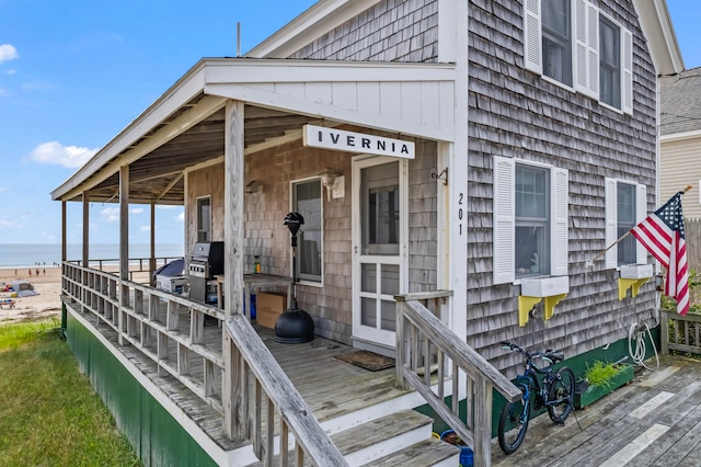 doorway to property featuring a water view