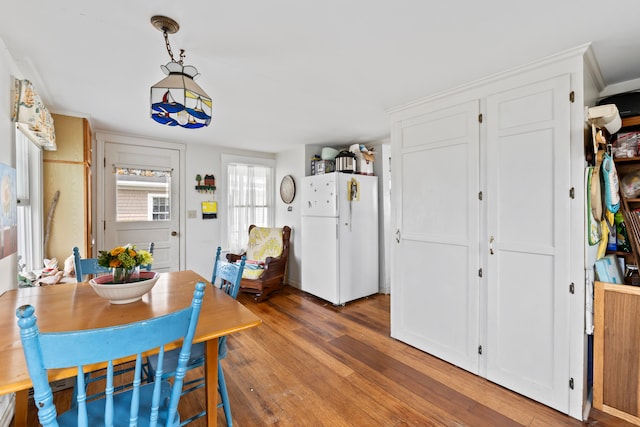 dining room with hardwood / wood-style floors