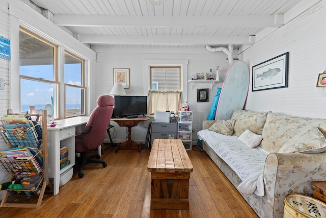 office space with beam ceiling, wooden ceiling, and light wood-type flooring