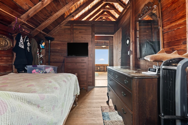 bedroom featuring wooden ceiling, lofted ceiling with beams, light wood-type flooring, and wood walls