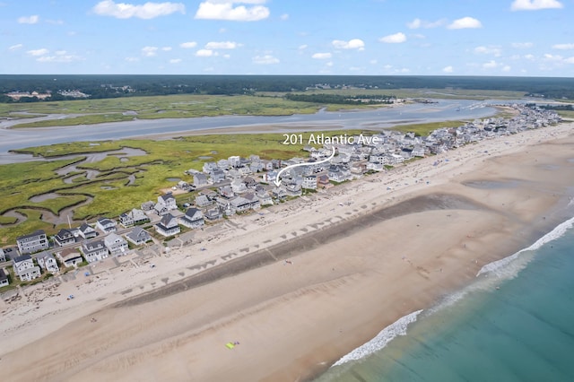 aerial view featuring a water view and a beach view