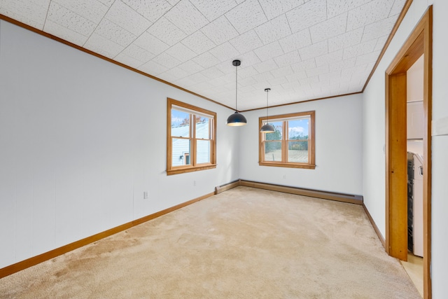 spare room featuring a baseboard radiator, light carpet, and ornamental molding