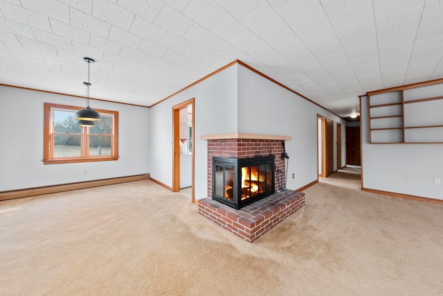 unfurnished living room with a brick fireplace, crown molding, a baseboard heating unit, and carpet