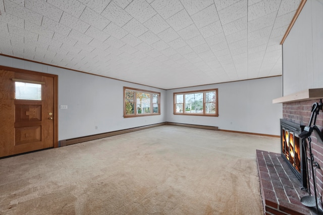 unfurnished living room with a fireplace, a baseboard radiator, light carpet, and crown molding