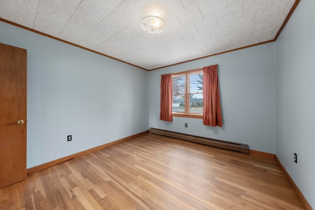 unfurnished room featuring a baseboard heating unit, light wood-type flooring, and ornamental molding