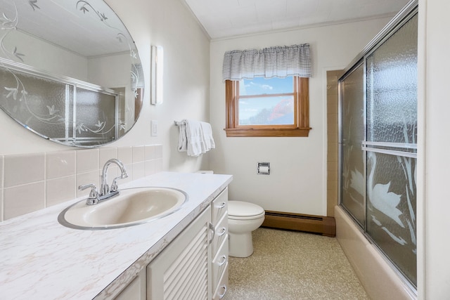 full bathroom with vanity, bath / shower combo with glass door, decorative backsplash, a baseboard radiator, and toilet