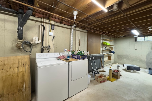 laundry room with washing machine and clothes dryer