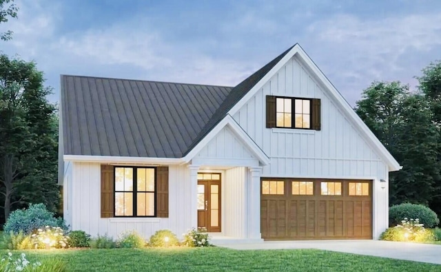 modern inspired farmhouse featuring a garage and a front lawn