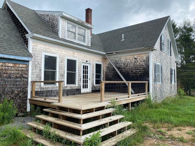 rear view of property featuring a deck