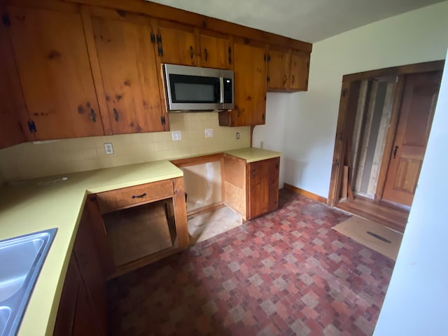 kitchen with sink and tasteful backsplash