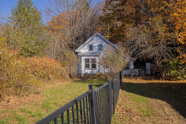 view of property exterior with a yard