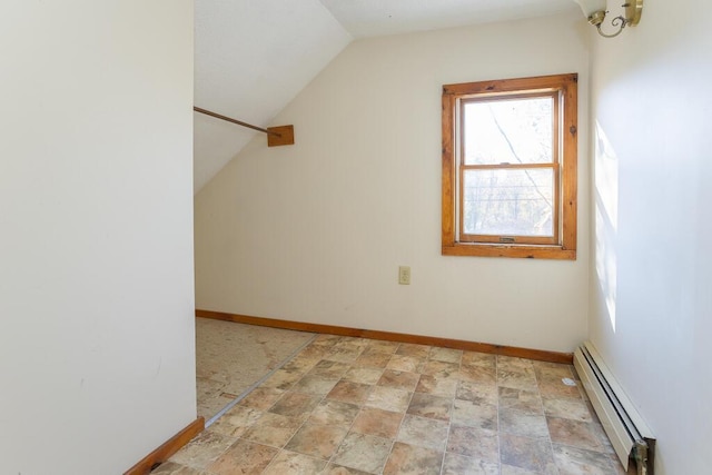 additional living space with baseboard heating and lofted ceiling