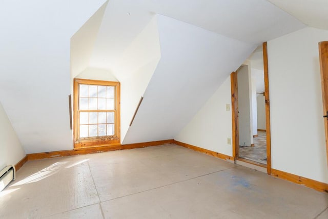 additional living space featuring lofted ceiling