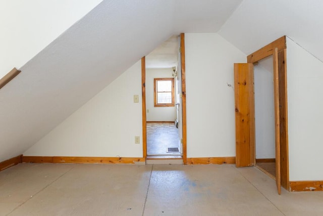 bonus room with vaulted ceiling