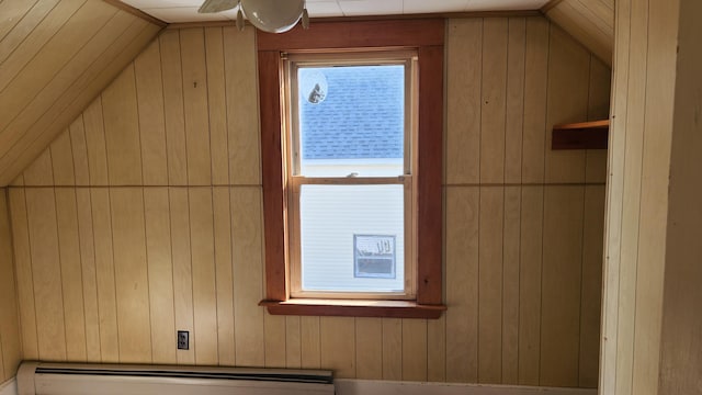 185 Knox St, Millinocket, ME 04462 - bonus room featuring wood walls, a baseboard radiator, and lofted ceiling