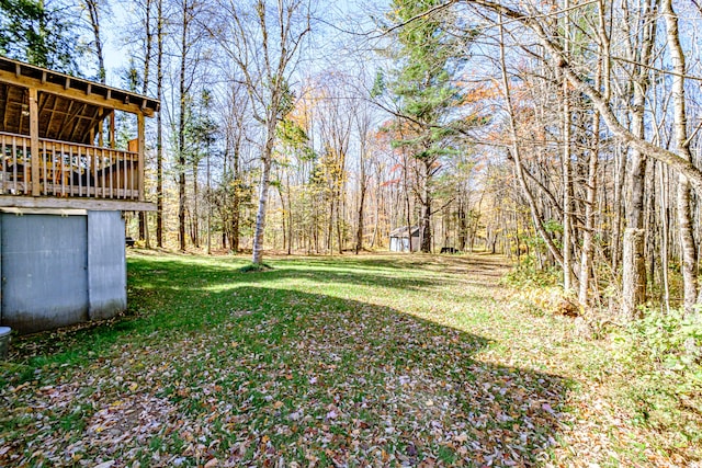 view of yard with a wooden deck