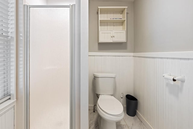 bathroom with toilet and walk in shower