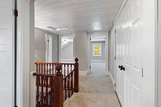 corridor featuring light colored carpet