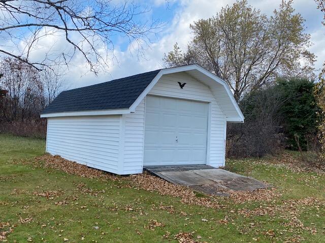 garage with a yard