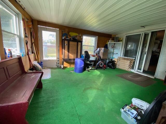 interior space featuring carpet flooring and wooden ceiling