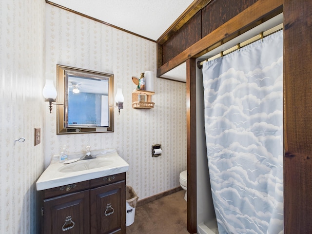 1388 Van Buren Rd, Connor Twp, ME 04736 - full bath featuring toilet, a shower with curtain, wallpapered walls, vanity, and ornamental molding