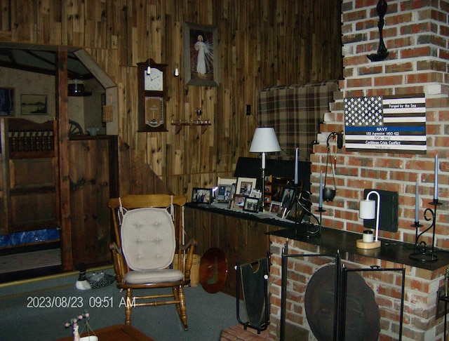 office area with wood walls and carpet floors