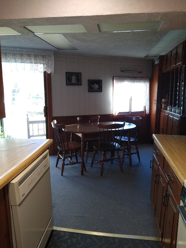 162 Hill Rd Unit T1 R9, Wels, ME 04462 - dining area featuring wallpapered walls and dark colored carpet
