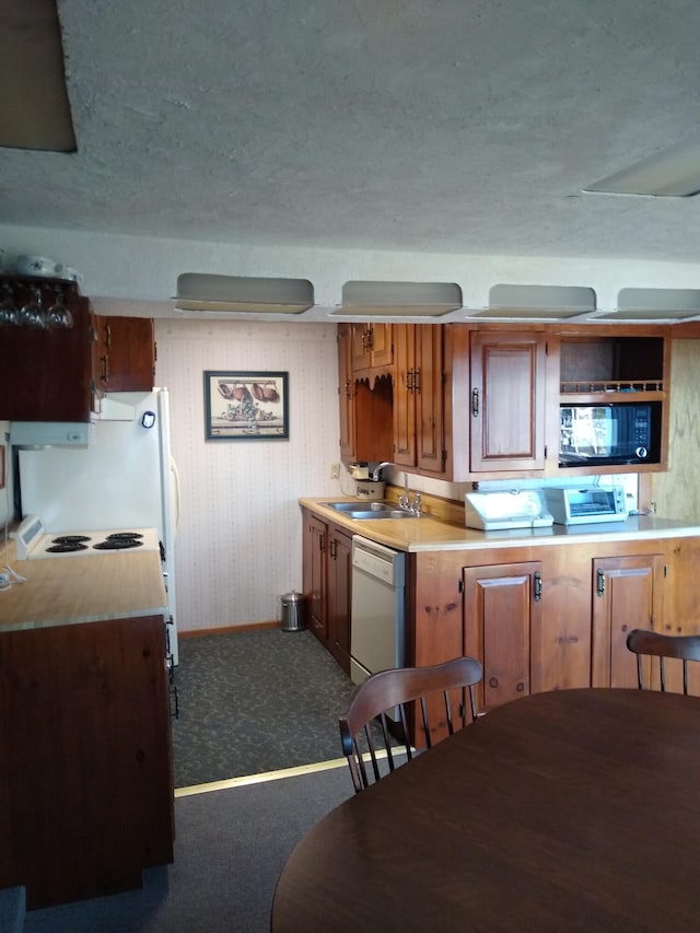 162 Hill Rd Unit T1 R9, Wels, ME 04462 - kitchen featuring dishwasher, light countertops, a textured ceiling, dark colored carpet, and black microwave