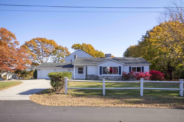 32 Morison Ave, Wells, ME 04090 - ranch-style house featuring a front yard, a garage, fence private yard, driveway, and a chimney