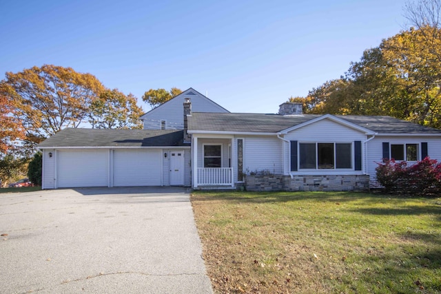 32 Morison Ave, Wells, ME 04090 - ranch-style house with a front yard, driveway, and an attached garage