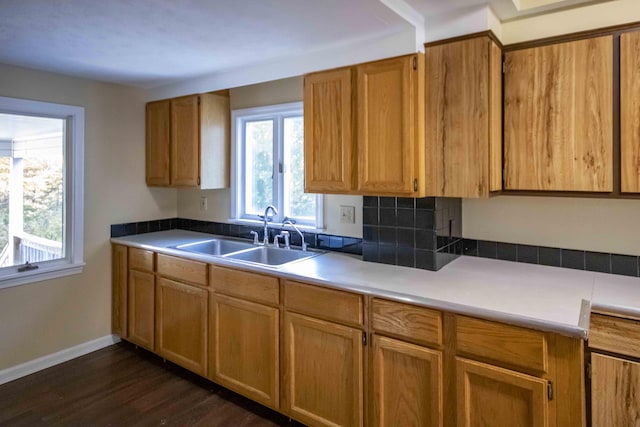 32 Morison Ave, Wells, ME 04090 - kitchen with brown cabinetry, light countertops, dark wood-type flooring, and a sink