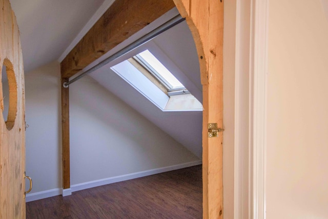 32 Morison Ave, Wells, ME 04090 - additional living space with baseboards, wood finished floors, and vaulted ceiling with skylight