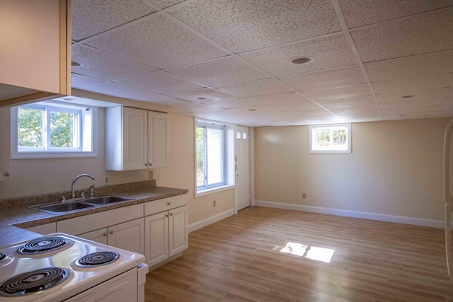 32 Morison Ave, Wells, ME 04090 - kitchen with a sink, light wood-style floors, baseboards, white electric range, and a drop ceiling