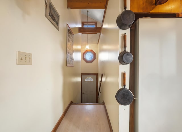 doorway to outside featuring light hardwood / wood-style floors and high vaulted ceiling